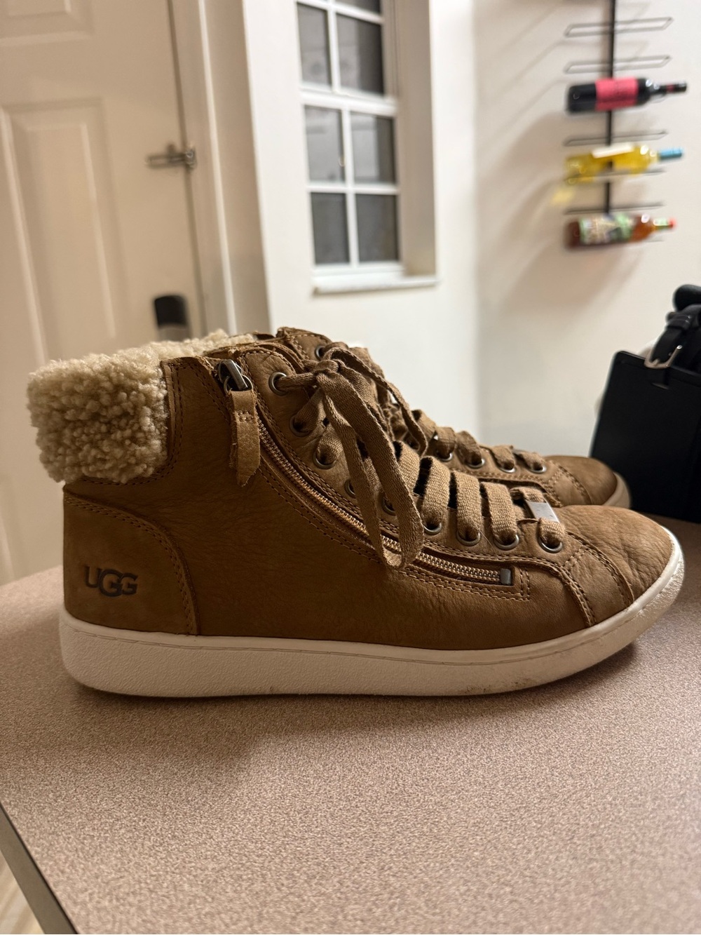UGG high top fur lined sneaker size 9